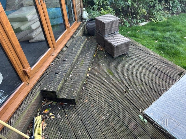 Weathered old garden decking beside the summerhouse before it was replaced in Chigwell