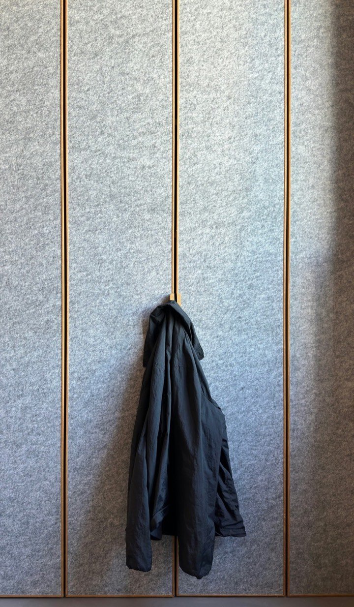 Full-height felt wall panels with slim reveals
