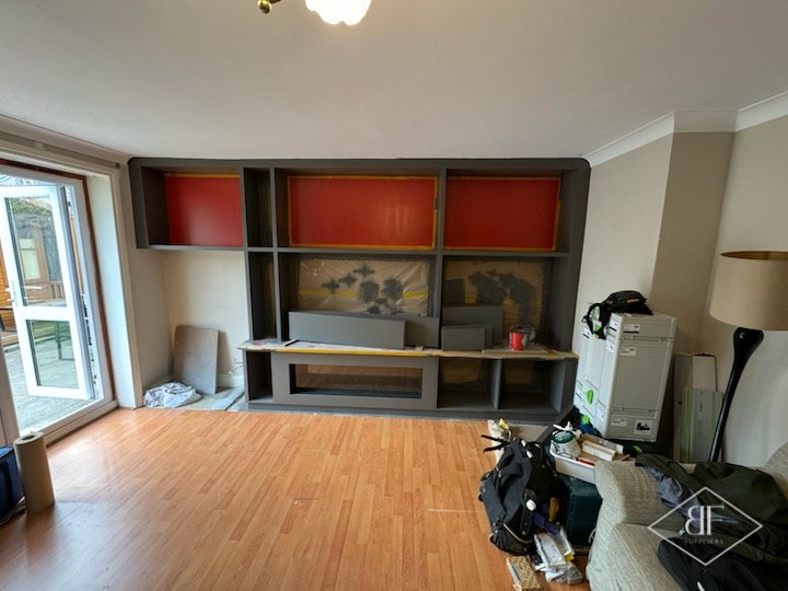 Wide view of the nearly finished media wall in the living room