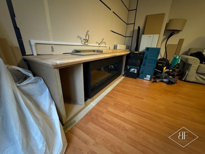 Fire surround and oak worktop taking shape during the early build stage