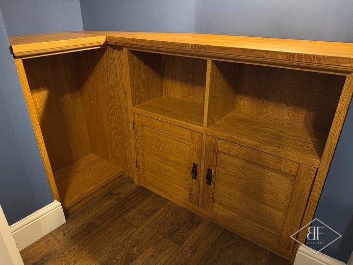 Close view of oak alcove cupboard doors, open shelf recesses and solid oak top