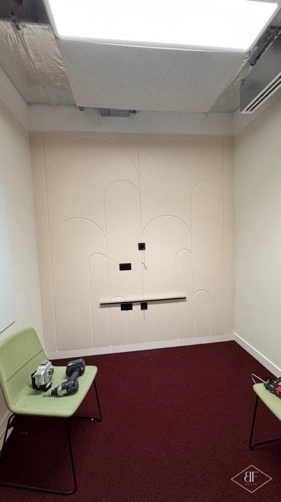Arched routed wall panels in a meeting room
