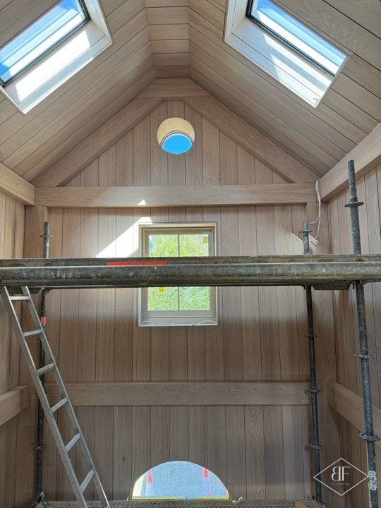 Oak lined gable with rooflights, scaffold platform and ladder during installation